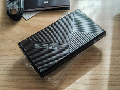 Reproductor de audio digital FiiO JM21 con Android 13 y Snapdragon 680, pantalla y controles visibles en la imagen.