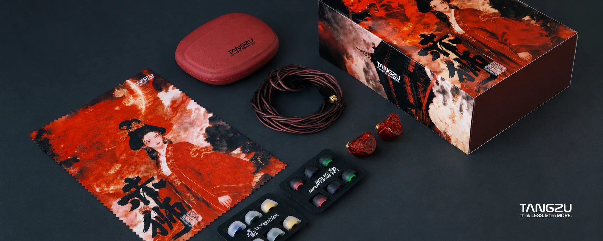 Collection of items including a red case, a box with Japanese text, and a small bag on a dark background.